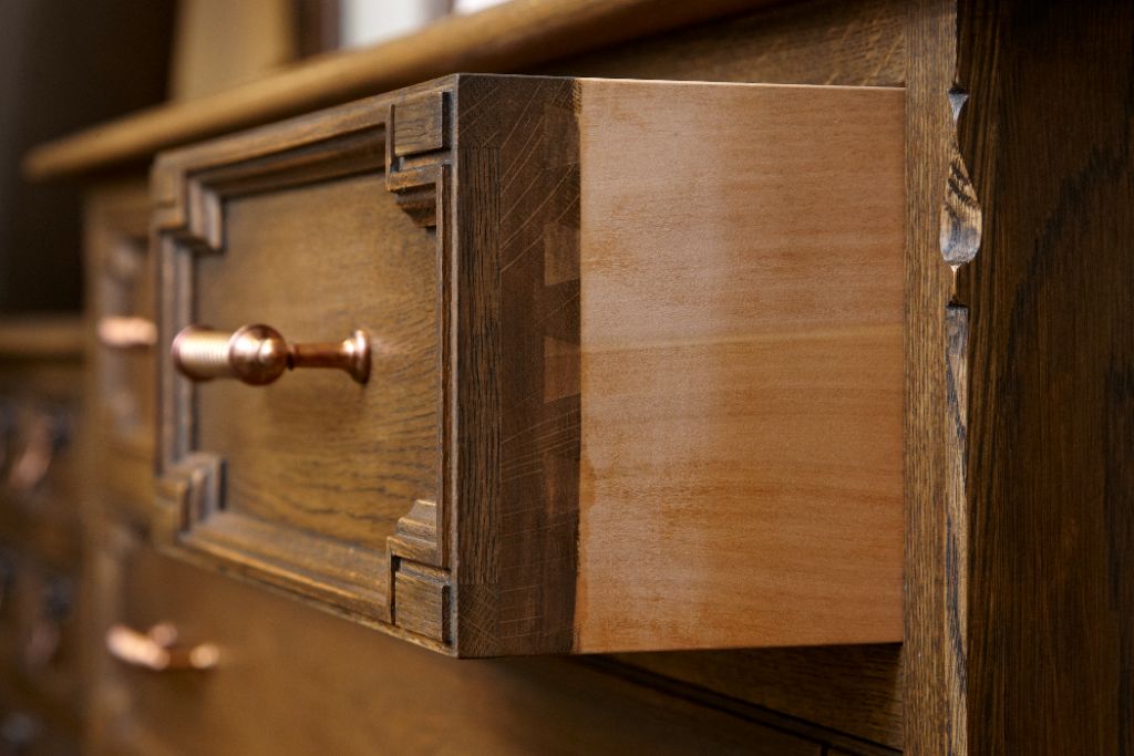 An open wooden drawer showing its joinery